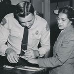 Civil rights activist Rosa Parks is fingerprinted by a deputy sheriff in Montgomery, Alabama, for her role in the Montgomery Bus Boycott, February 1956. (Wikimedia Commons)